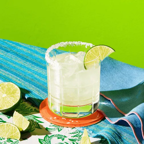Glass of Hornitos® Fresh Margarita garnished with lemon slice