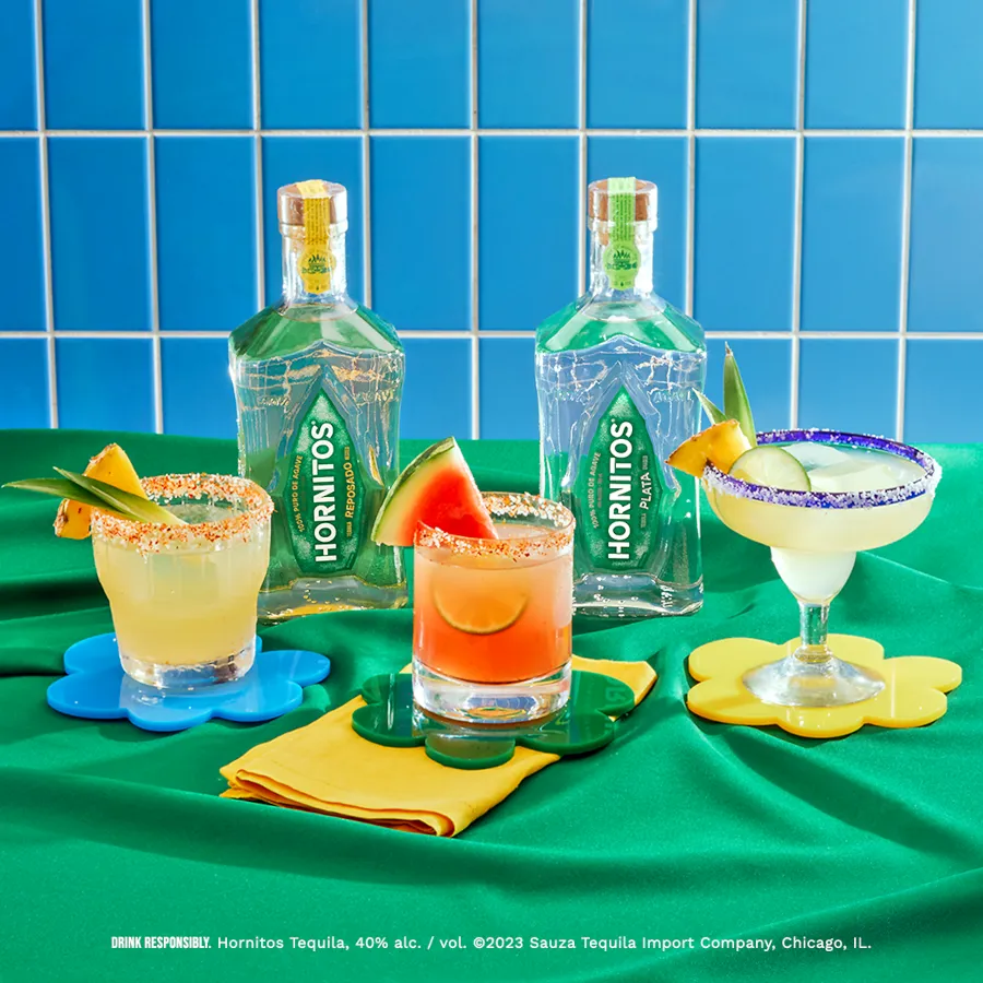 Two plata bottles with three cocktails