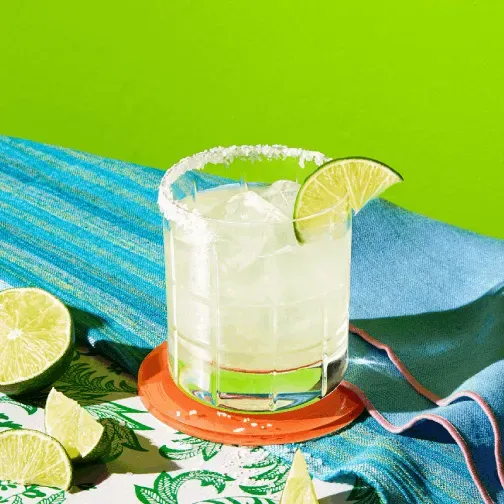Glass of Hornitos® Fresh Margarita garnished with lemon slice